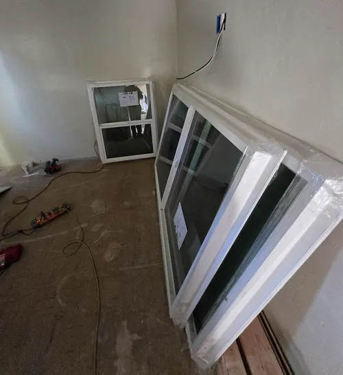 Weatherstrip doors and re-caulk windows